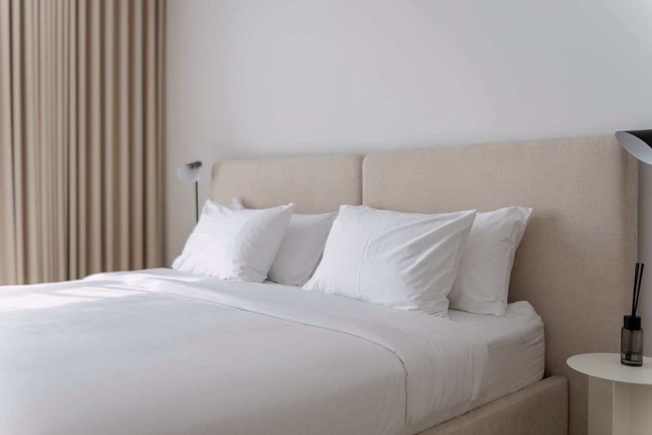 Mastering the First Impression: Your intriguing post title goes here Elegant neutral-toned bedroom with plush bedding, perfect for vacation rentals or Airbnb listings.